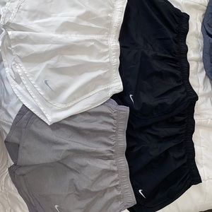 4 pairs of Nike Tempo shorts
